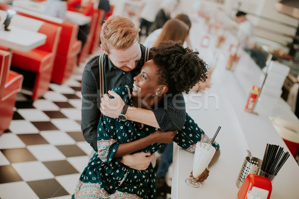 Couple hugging by the bar in the diner Stock photo © boggy