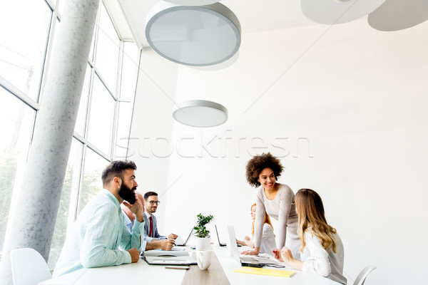 Business people around table during staff meeting Stock photo © boggy