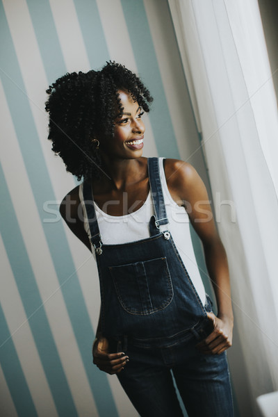 Stockfoto: Mooie · afro-amerikaanse · vrouw · poseren · jeans · broek