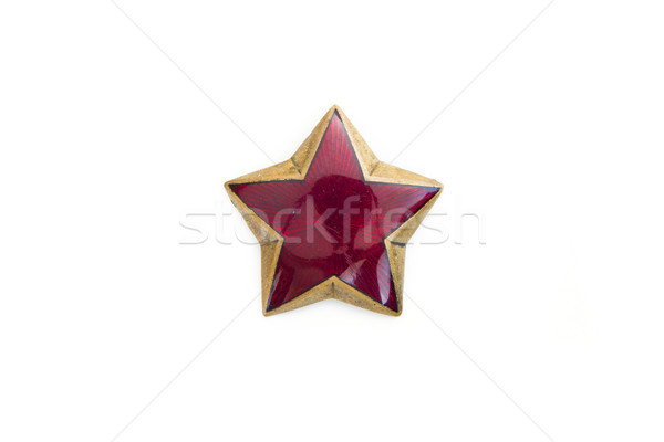 Old red star from military cap isolated on the white background Stock photo © boggy