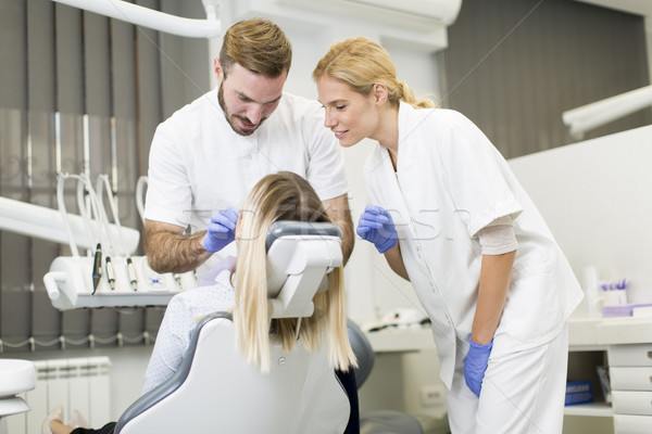 Dental treatment in dentist office Stock photo © boggy