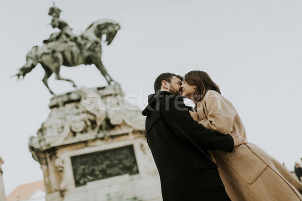 Loving couple outdoor with monument in background in Budapest Stock photo © boggy
