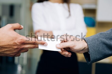 Closeup of businesspeople exchanging business card Stock photo © boggy