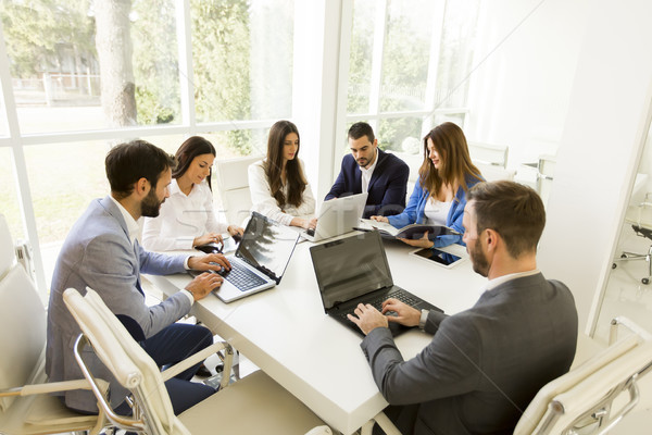Young business people keeping team building in a modern office Stock photo © boggy