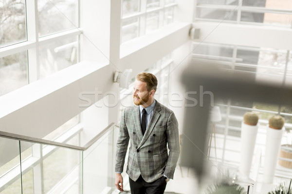 Redhair businessman on stairs Stock photo © boggy