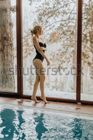 Pretty young woman relaxing in the bubble bath pool Stock photo © boggy