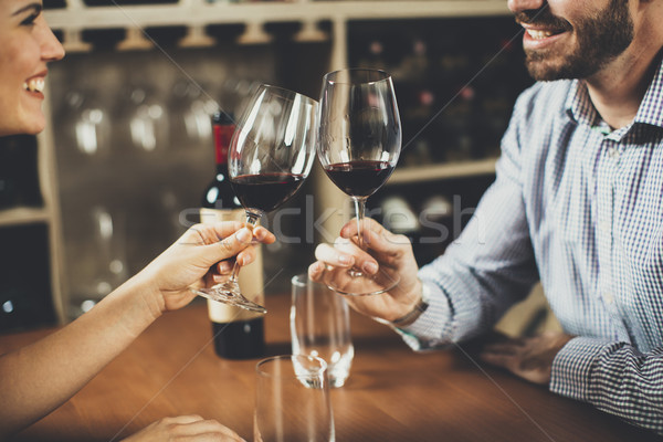 Handsome young couple on the date in wine bar Stock photo © boggy