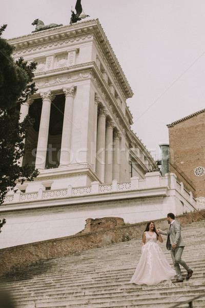 Bride and groom walking outdoors at Spagna Square and Trinita' d Stock photo © boggy