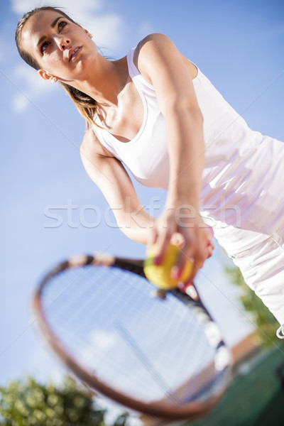 Young woman playing tennis Stock photo © boggy