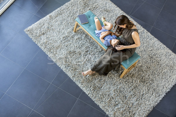 Little daughter lay on her mother's lap and enjoy, view from abo Stock photo © boggy