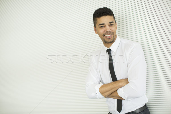 Jeunes homme noir gris mur élégant permanent [[stock_photo]] © boggy