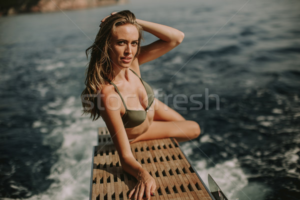 Jovem mulher atraente luxo iate flutuante mar Foto stock © boggy