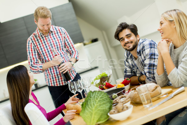 Young people at the table in kitchen Stock photo © boggy