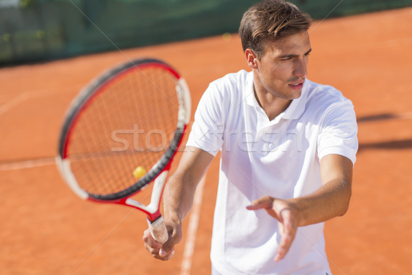 Joven jugando tenis verano jóvenes formación Foto stock © boggy