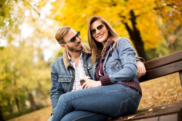Stock photo: Young couple in the autumn park