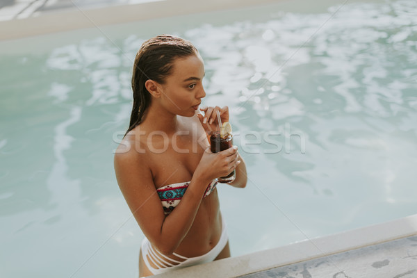 Young woman drinking coctail at hot summer day Stock photo © boggy