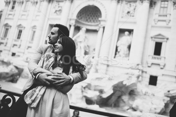 Tourist couple on travel by Trevi Fountain in Rome, Italy. Stock photo © boggy