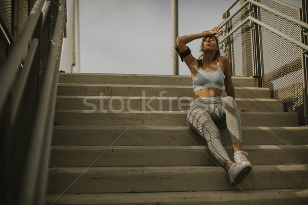 Jóvenes femenino corredor escaleras retrato Foto stock © boggy