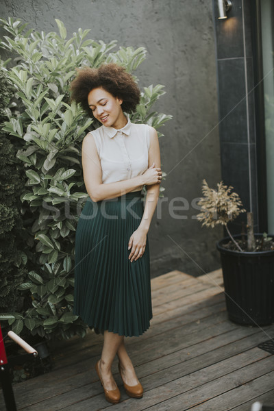 Pretty young african descent woman in the yard Stock photo © boggy