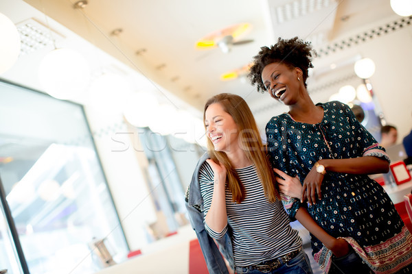 Young multiethnic women in the diner Stock photo © boggy