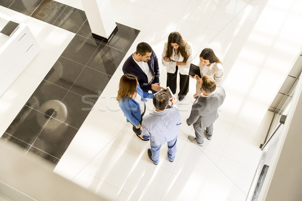 Young business people in the modern office, viewed from above Stock photo © boggy
