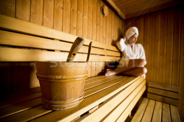 Young woman relaxing in the sauna at spa center Stock photo © boggy