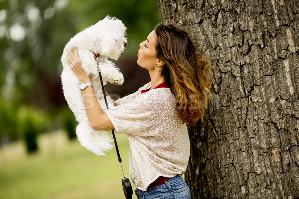 Young woman with a maltese dog Stock photo © boggy