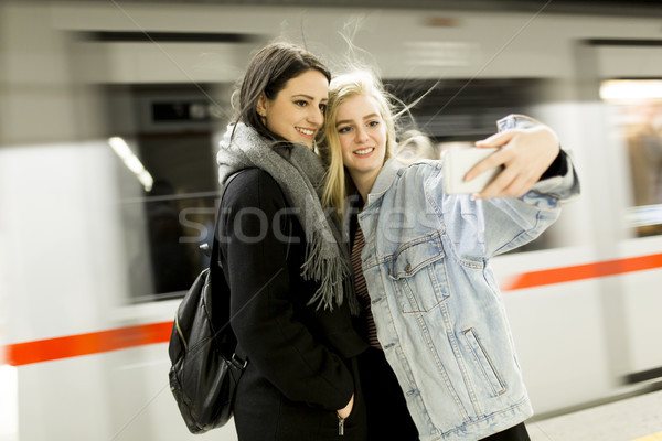 Young women taking selfie in subway Stock photo © boggy