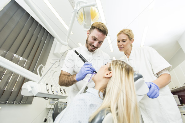 Dental mulher jovem tratamento homem feliz Foto stock © boggy