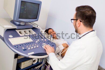 Doctor  doing medical examination of patient with ultra sound Stock photo © boggy