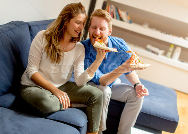 Couple eating pizza Stock photo © boggy