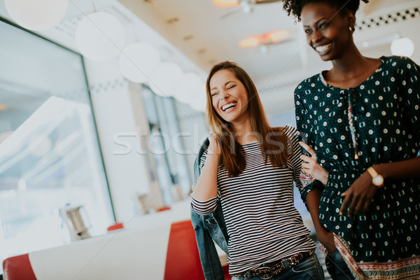 Young multiethnic women in the diner Stock photo © boggy