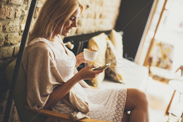 Young blond woman in the cafe Stock photo © boggy