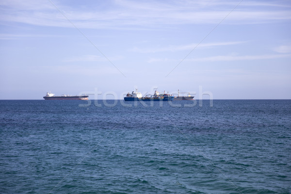 Stock photo: Cargo ships on the horizon