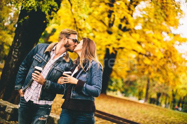 Couple with coffee to go in the park Stock photo © boggy
