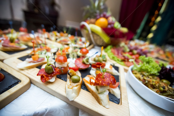 Beautifully decorated catering banquet table with different food Stock photo © boggy