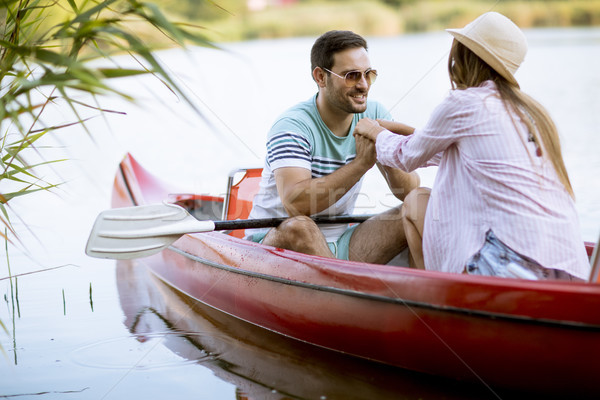 Close up portrait of romantic couple boating on the lake Stock photo © boggy
