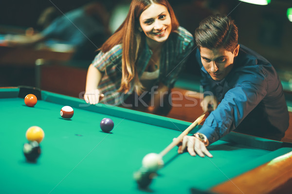 Young couple playing pool Stock photo © boggy