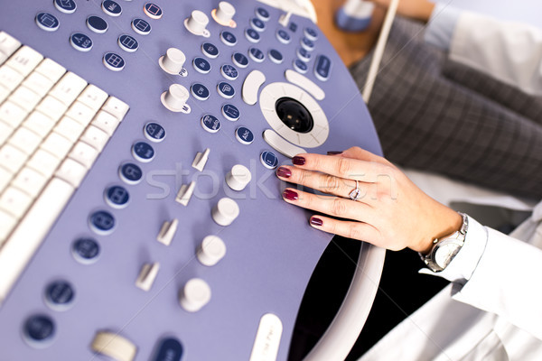 Doctor working on ultrasounds keyboard Stock photo © boggy