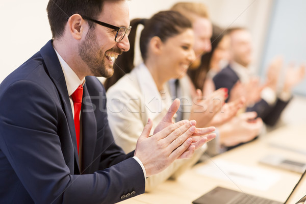 Group of business people clapping their hands at the meeting Stock photo © boggy