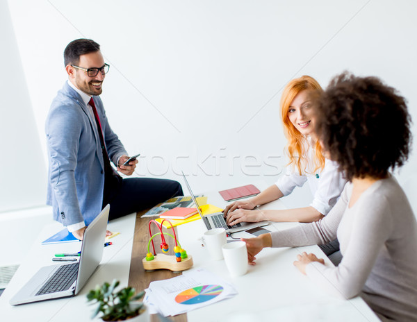 Business people around table during staff meeting Stock photo © boggy