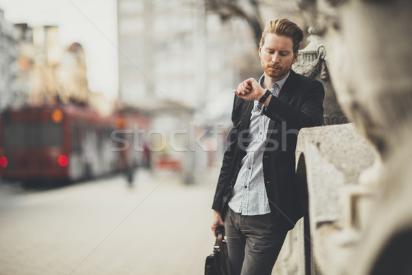Young businessman on the street Stock photo © boggy