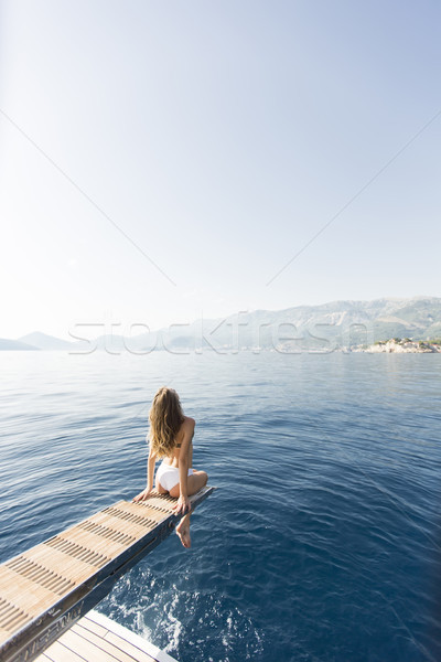 Fiatal vonzó nő ül luxus jacht lebeg Stock fotó © boggy