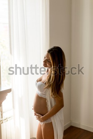 Mujer sexy lencería pie ventana dormitorio retrato Foto stock © boggy