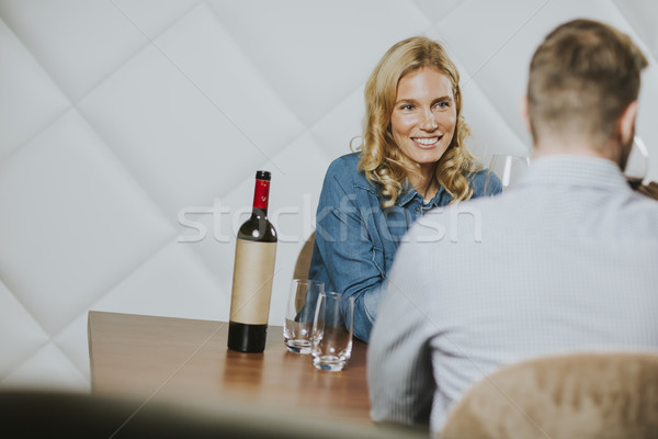 Jóképű pár randevú ül asztal borozó Stock fotó © boggy