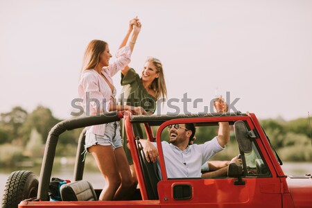 Young people having fun traveling together Stock photo © boggy