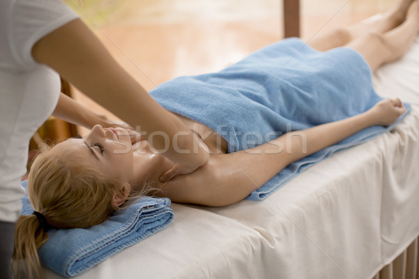 Stock photo: Pretty young blonde woman having a massage