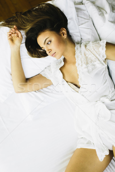 Above view of pretty woman in bed Stock photo © boggy