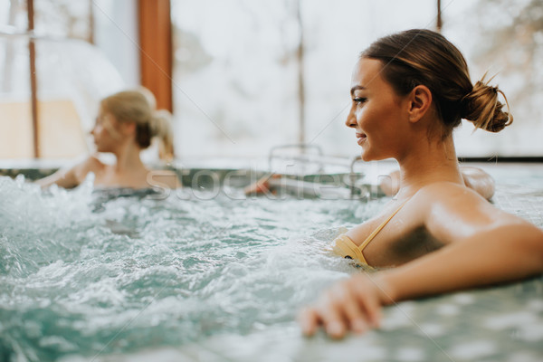 Stock photo: Young woman relaxing in the whirlpool bathtub