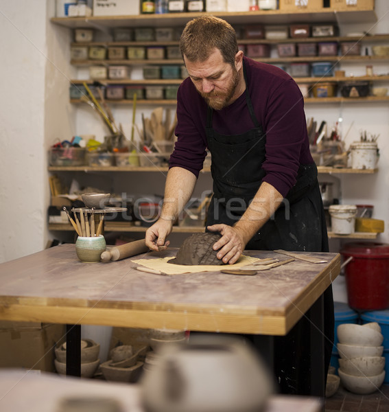 Stock photo: Skilled master preparing clay workpieces for new his creations